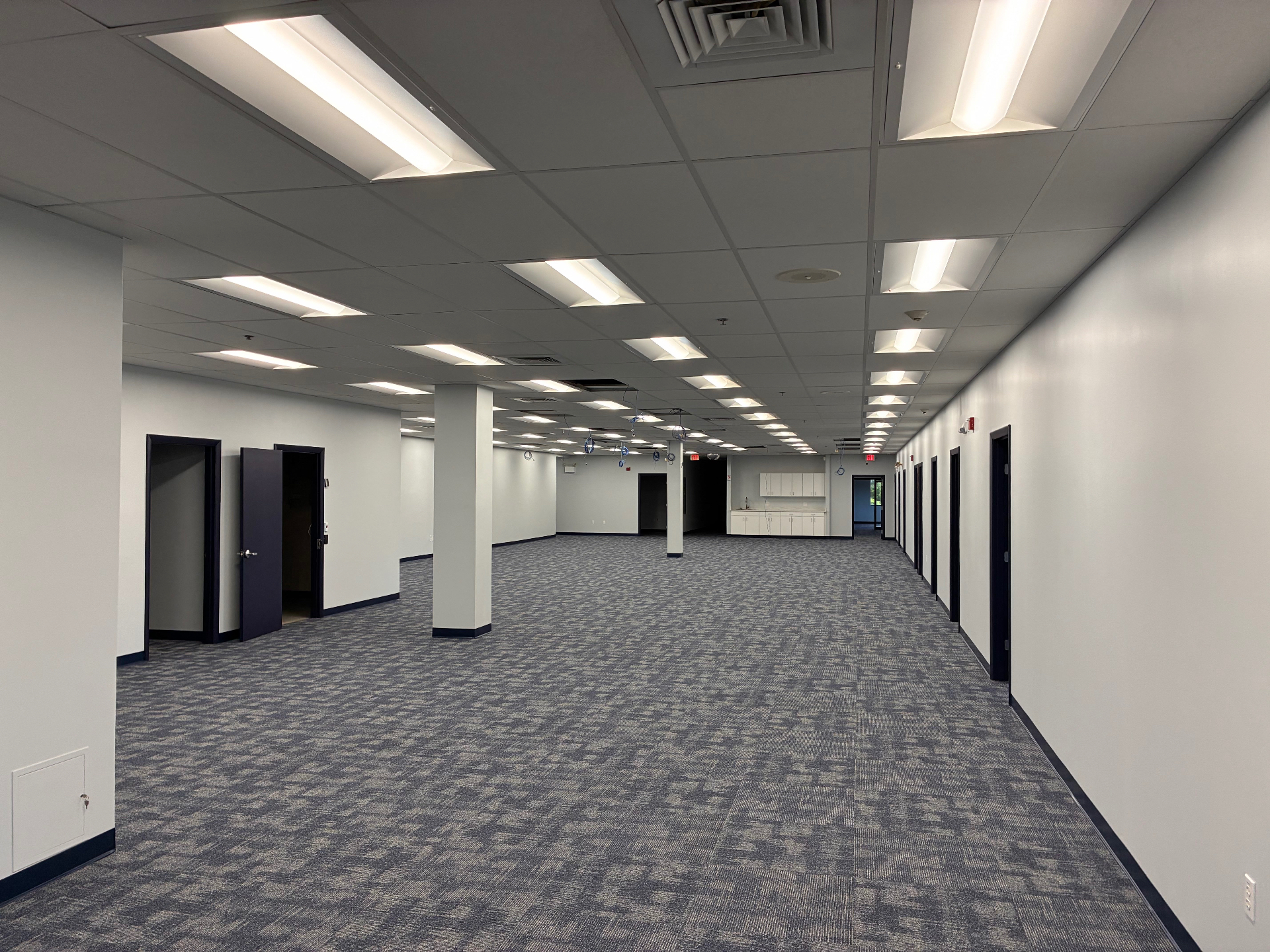 After renovation view of a completed office interior with finished walls and flooring