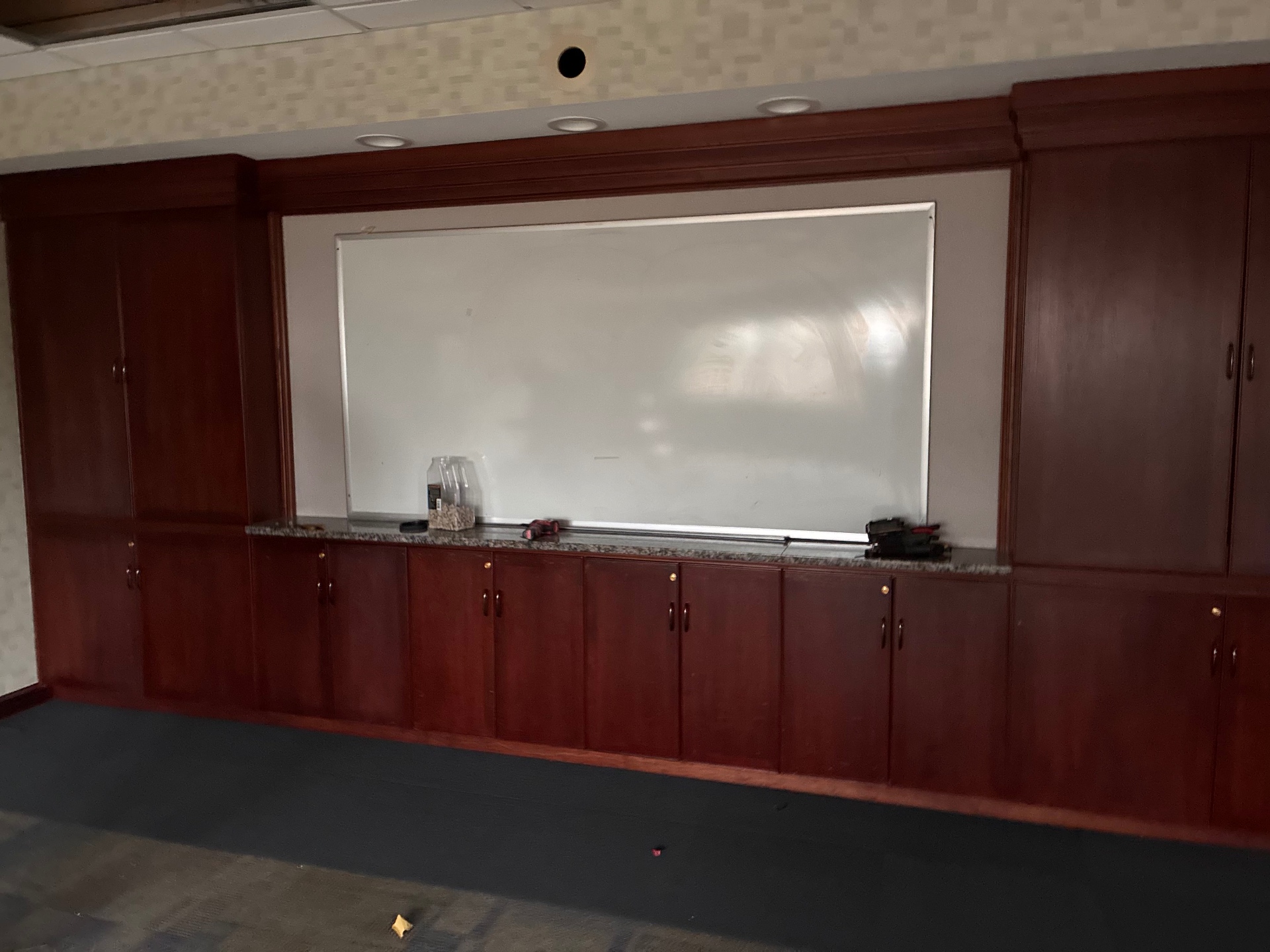 Before fit-out photo of a room with rough cabinetry and incomplete finishes
